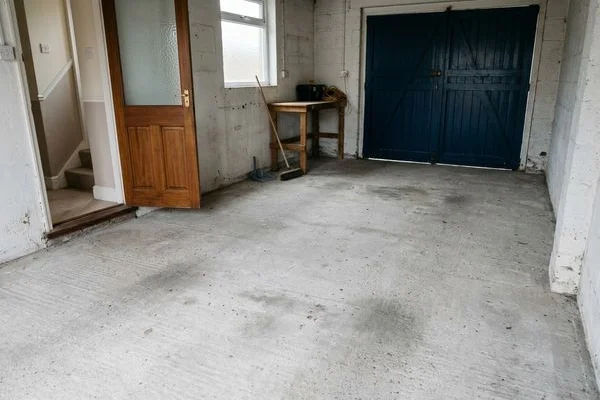 Empty swept garage floor after clearance