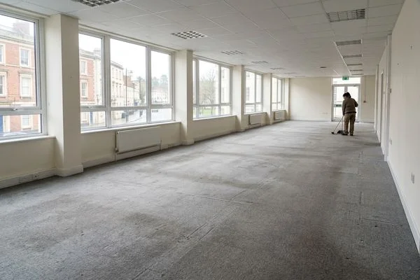Empty swept office floor after commercial clearance