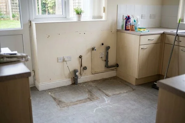Empty utility room after appliance removal